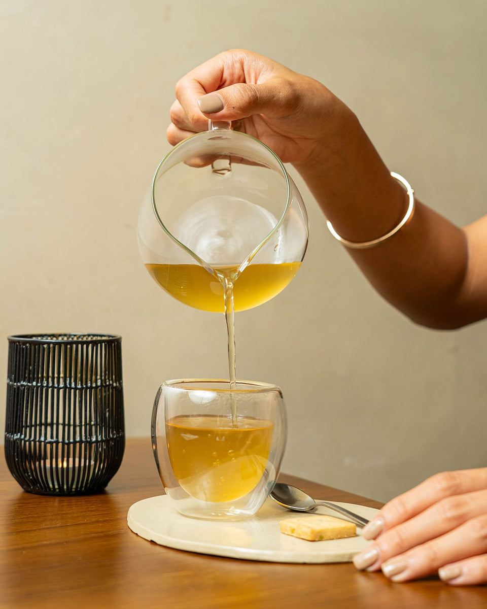 Jar of organic matcha on light background