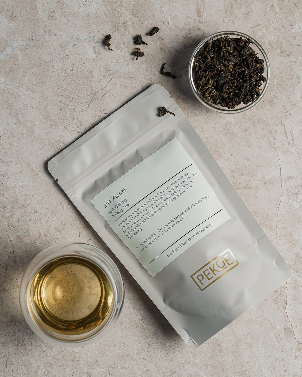 Jar of organic matcha on light background