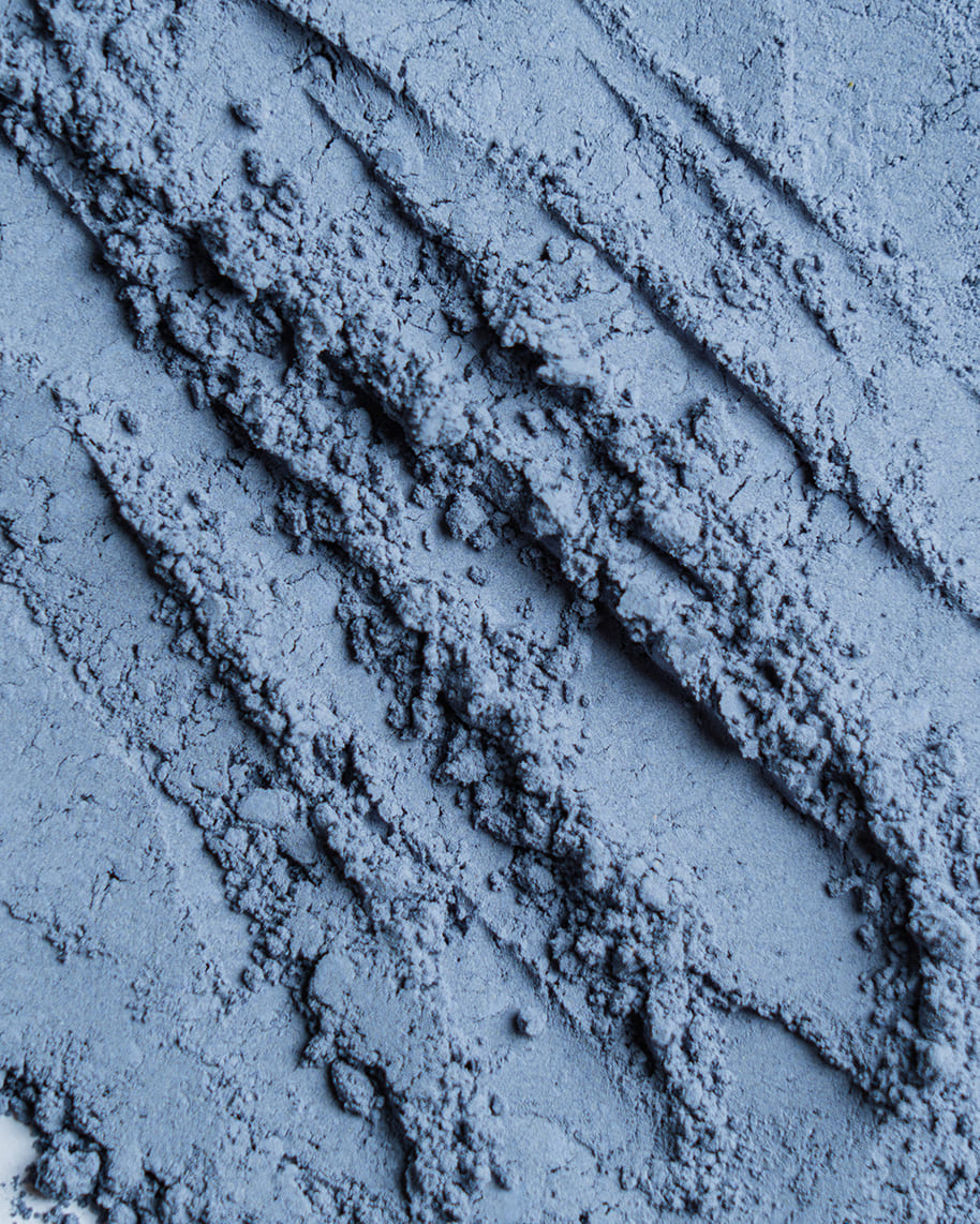 Jar of organic matcha on light background